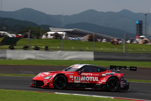 The blue-and-white #24 Realize Corporation Z in action at Fuji Speedway